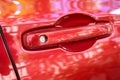 door handle of red car, transportation industry