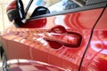 door handle of red car, transportation industry