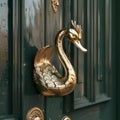 Door handle with a swan in the shape of a dragon