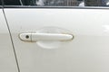 Door handle of white old car, dirty door handle and scratch of white car Royalty Free Stock Photo