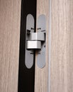 Door hinge for interior doors, close-up. Accessories for doors webbing for closing the doorway Royalty Free Stock Photo