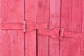 Door hinges of an old wooden outdoor building Royalty Free Stock Photo