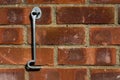 Door hook hanging on a brick wall