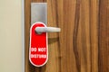 Door of hotel room with sign please do not disturb. Royalty Free Stock Photo