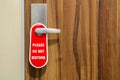 Door of hotel room with sign please do not disturb. Royalty Free Stock Photo