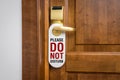 Door of hotel room with sign please do not disturb Royalty Free Stock Photo