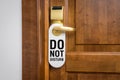 Door of hotel room with sign please do not disturb Royalty Free Stock Photo