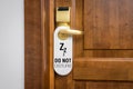 Door of hotel room with sign please do not disturb Royalty Free Stock Photo