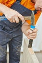 Door installation works with hummer and chisel Royalty Free Stock Photo