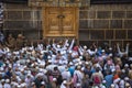 The door of the Kaaba - Multazam. Muslim pilgrims in motion in front of the door of the holy Kaaba.