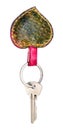 Door key on green heart shaped key ring cutout Royalty Free Stock Photo