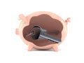 Door keys inside piggy bank Royalty Free Stock Photo