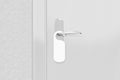 Door knob with blank doorhanger mock up. Empty white flyer mocku