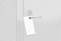 Door knob with blank flyer mock up. Empty white flier mockup Royalty Free Stock Photo