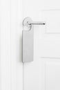 Door knob with empty label on a door handle for your text. Empty white flyer mockup hang on door handle. Leaflet design Royalty Free Stock Photo