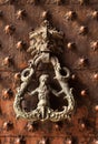 Door knocker on antique portal Royalty Free Stock Photo