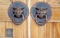 Door knocker on the door of traditional Chinese building. Royalty Free Stock Photo