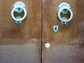 Door Knockers on a door, Siena, Tuscany, Italy Royalty Free Stock Photo