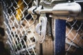 Door latches with an old metal fence net. Royalty Free Stock Photo