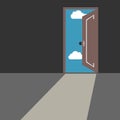 Door leading from dark gray room to blue sky with clouds and bright daylight. Royalty Free Stock Photo