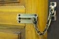 Door lock, chain lock on wooden door Royalty Free Stock Photo