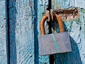 Door lock for key closing, keyhole, hasp bolt. Collection of old vintage retro locks on the textured colored door. Close-up