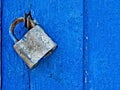 Door lock for key closing, keyhole, hasp bolt. Collection of old vintage retro locks on the textured colored door. Close-up