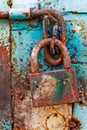 Door lock for key closing, keyhole, hasp bolt. Collection of old vintage retro locks on the textured colored door. Close-up