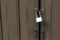 Door with lock. Lock on an old wooden gate. Old padlock on closed doors. Master key and old wood door for lock Royalty Free Stock Photo