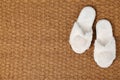 Door mat and slippers as background, top view Royalty Free Stock Photo