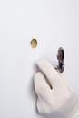 A door and mechanism installer, wearing protective gloves, sets up a peephole for observation Royalty Free Stock Photo