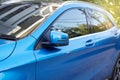 Door mirror of new blue car Royalty Free Stock Photo