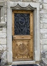 Door with the municipal coat of arms, Gules, a Crane rising Argent. Royalty Free Stock Photo