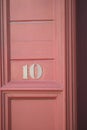 Door with number 10 in a bright red color Royalty Free Stock Photo