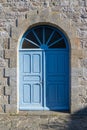 Door in old stone fort wall Houat island, France