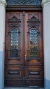 door. old wooden Front Door of a Traditional European Town House. Big Double Arch Door Royalty Free Stock Photo