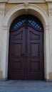 door. old wooden Front Door of a Traditional European Town House. Big Double Arch Door Royalty Free Stock Photo