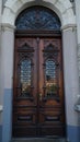 door. old wooden Front Door of a Traditional European Town House. Big Double Arch Door Royalty Free Stock Photo