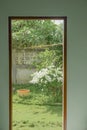 Door with open to View of the garden with green flower trees Royalty Free Stock Photo