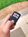 Door Remote Control in hand