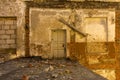 Door in a ruined house, inside view Royalty Free Stock Photo