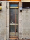 Door from the 80s in a stone facade. Modern