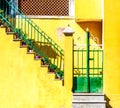 door and stairs on yellow wall Royalty Free Stock Photo