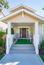 Door steps and concrete pathway leading to residential house entrance