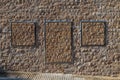 Door in a stone wall. Old beige stone wall background texture close up Royalty Free Stock Photo