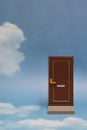 Door to new world. Close door on blue sunny sky with fluffy clouds. Royalty Free Stock Photo