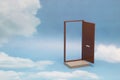 Door to new world. Open door on blue sunny sky with fluffy clouds. Royalty Free Stock Photo