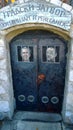 The door to the pantry of the restaurant stylized as a prison cell with images of politicians in the city of Emir Kusturica