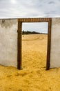 A door to the sea on concrete fence on the sea beach Royalty Free Stock Photo