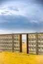 A door to the sea on concrete fence on the sea beach Royalty Free Stock Photo